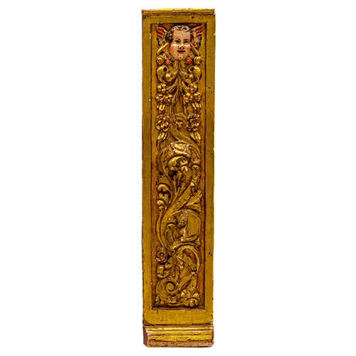 Sub.:15 - Lote: 141 -  Pilastra en madera tallada, dorada y policromada con cabeza de querubn, roleos y guirnaldas vegetales. S. XVII.