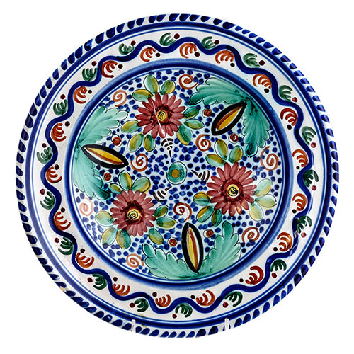 Sub.:1-On - Lote: 286 -  Plato en ceramica esmaltada, con decoracin polcroma realizada con motivos florales en el centro y orlas geomtricas en el ala. Firmado en la base 