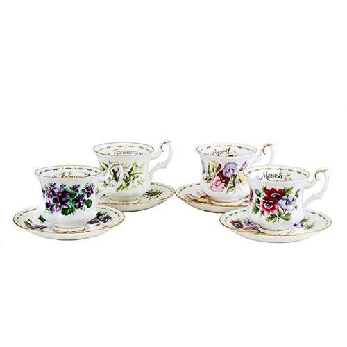 Sub.:1-On - Lote: 460 -  Lote de tacitas con platos a juego. Porcelana esmaltada con decoracin floral y cada una con la inscripcin de un mes del ao y una flor que lo identifica.