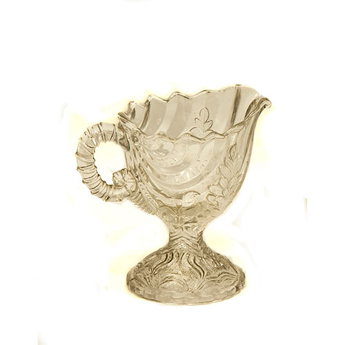 Sub.:11-On - Lote: 190 -  Jarrita en cristal prensado con perfil gallonado y motivos vegetales.