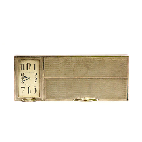 Sub.:11-On - Lote: 619 -  Reloj Art Decó con caja para barajas en metal plateado.