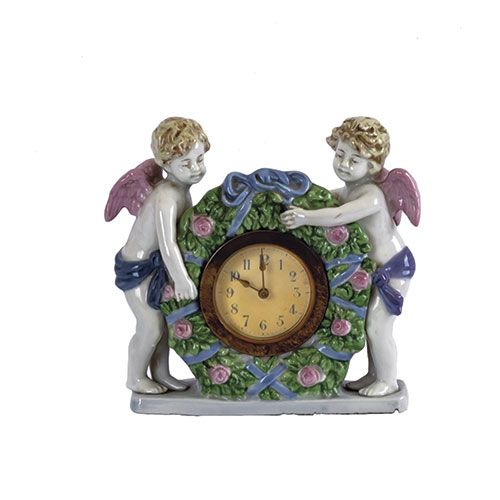 Sub.:12-On - Lote: 1251 -  Reloj en porcelana con pareja de ángeles.