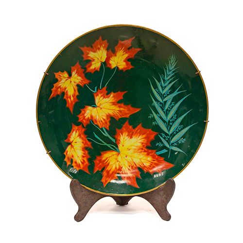 Sub.:13-On - Lote: 306 -  Plato decorativo en porcelana de Rosenthal con decoracin de hojas.
