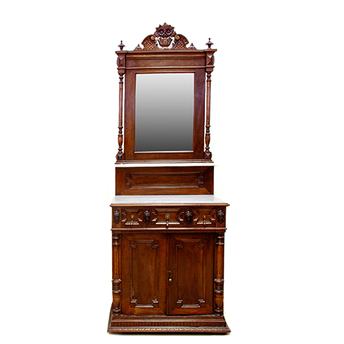 Sub.:13 - Lote: 1303 -  Lavabo en madera de nogal con dos cuerpos, el inferior con dos puertas flanqueadas por columnas y dos cajones en cintura, separados por cuatro efigies femeninas. 