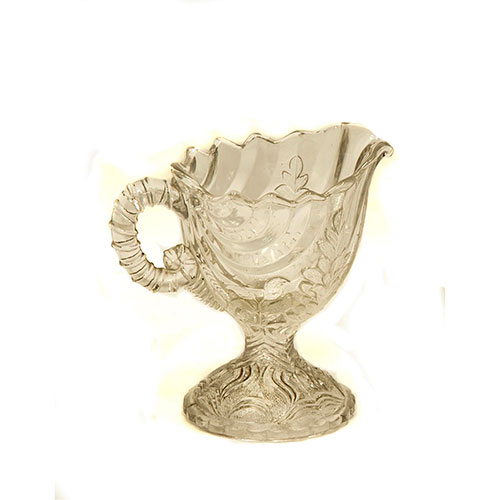 Sub.:14-On - Lote: 1422 -  Jarrita en cristal prensado con perfil gallonado y motivos vegetales.