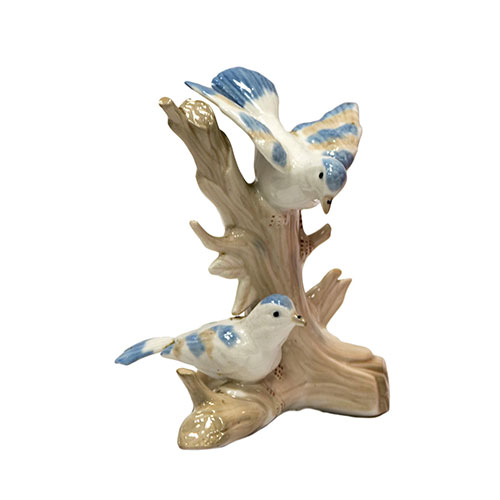 Sub.:14-On - Lote: 1337 -  Figura en porcelana de dos pajaritos posados sobre un �rbol.