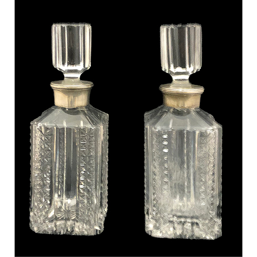 Sub.:16-Oc - Lote: 297 -  Pareja de licoreras en cristal tallado con embocadura de plata