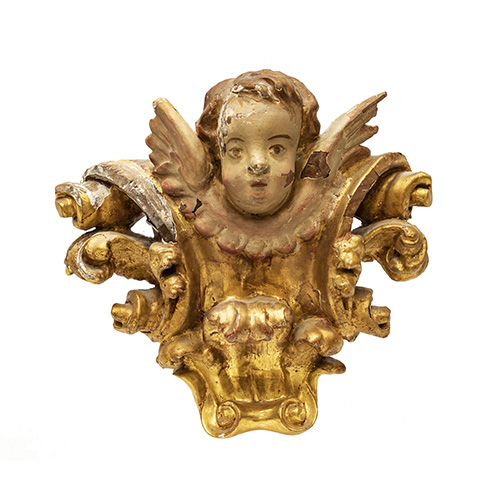 Sub.:17 - Lote: 1335 -  Aplique de retablo con cabeza de ngel, realizado en madera policromada. ca. 1700. 