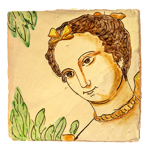 Sub.:18 - Lote: 1203 -  Baldosa en cermica de Muel con representacin de cabeza de mujer.