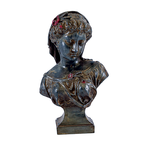 Sub.:20 - Lote: 1274 -  Busto de mujer realizado en calamina con detalles en rojo.