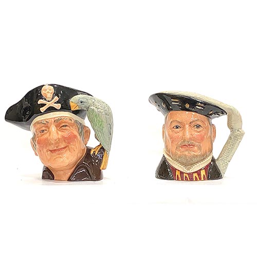 Sub.:22 - Lote: 1460 -  Dos jarras en porcelana inglesa Royal Doulton con personajes: Enrique VIII y Long John Silver.