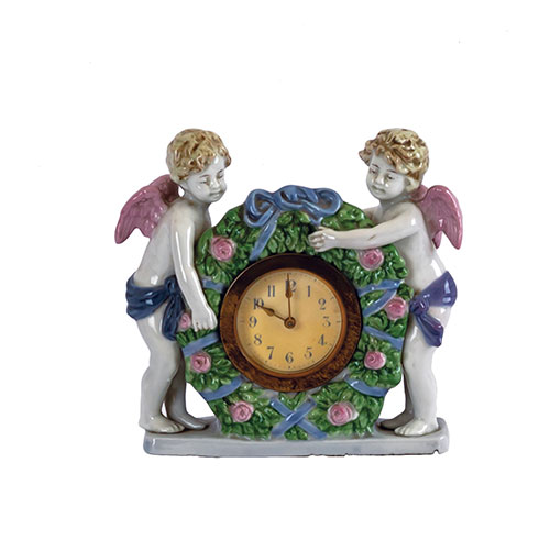 Sub.:24 - Lote: 164 -  Reloj en porcelana con pareja de ngeles.