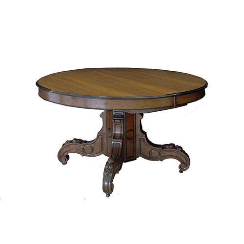 Sub.:24 - Lote: 310 -  Mesa de comedor en madrea de nogal con pie central y alargues.