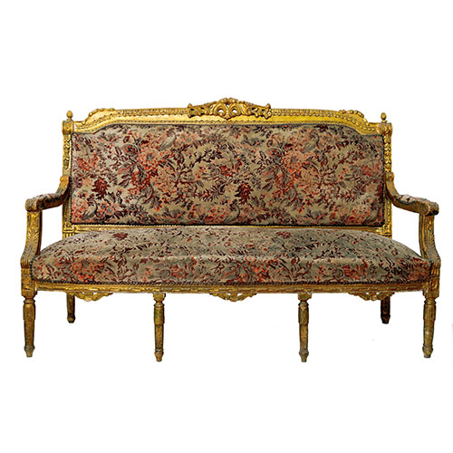 Sub.:27 - Lote: 225 -  Canap modelo Luis XVI en madera tallada y dorada con tapicera floral.
