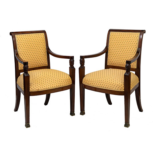 Sub.:31 - Lote: 149 -  Pareja de sillones en caoba de �poca imperio con cabezas egipcias talladas y pies de garra en bronce.