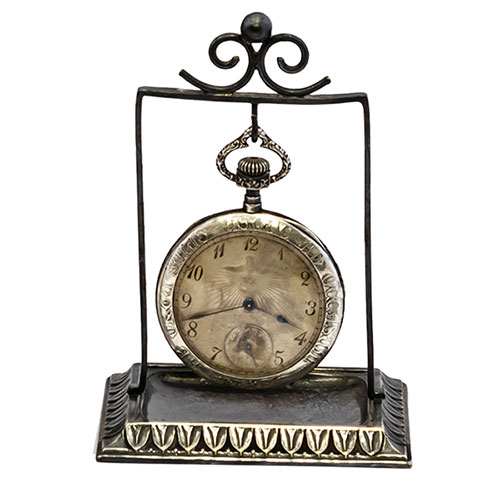 Sub.:32 - Lote: 279 -  Reloj con relojera de temas religiosos.