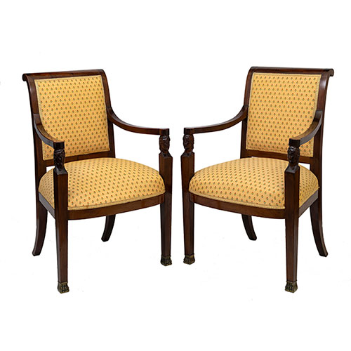 Sub.:32 - Lote: 1277 -  Pareja de sillones en caoba de �poca imperio con cabezas egipcias talladas y pies de garra en bronce.