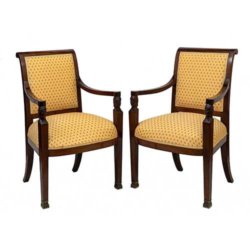 Sub.:34 - Lote: 254 -  Pareja de sillones en caoba de �poca imperio con cabezas egipcias talladas y pies de garra en bronce.