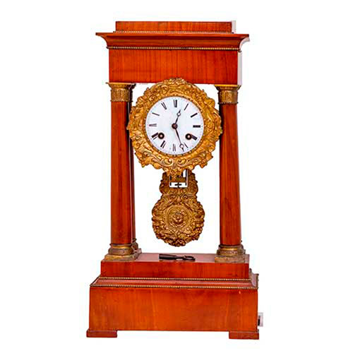 Sub.:35 - Lote: 293 -  Reloj de columnas en palo rosa y bronce dorado