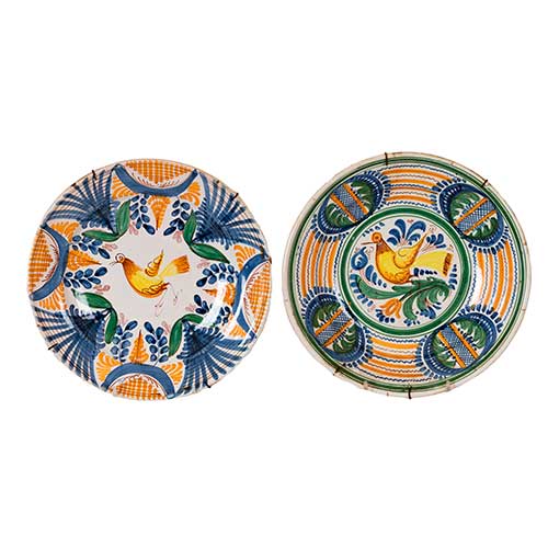 Sub.:36 - Lote: 307 -  Dos platos de Manises con motivos de p�jaros. Tonos amarillos.