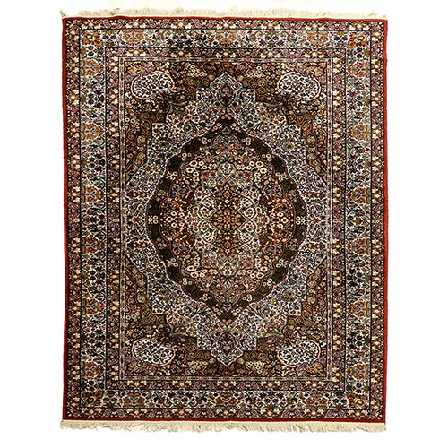 Sub.:7-On - Lote: 295 -  Alfombra oriental en lana con medall�n central y borde con repetici�n de temas florales. Buen estado de conservaci�n.