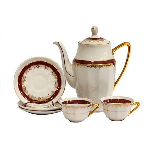Sub.:8-On - Lote: 340 -  Lote de 8 tazas con 9 platos y cafetera en porcelana de Limoges con banda roja y cenefa en dorado.